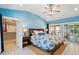 Serene bedroom featuring a walk-in closet and sliding glass doors to outdoor space at 420 E Erie Ave, Folly Beach, SC 29439