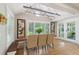 Dining area with built-in bench and view of backyard at 420 E Erie Ave, Folly Beach, SC 29439