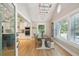 Bright dining area with farmhouse table and ladder light fixture at 420 E Erie Ave, Folly Beach, SC 29439