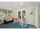Inviting front porch with rocking chairs and comfy seating at 420 E Erie Ave, Folly Beach, SC 29439