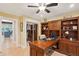 Spacious home office with built-in shelving and L-shaped desk, near kitchen at 420 E Erie Ave, Folly Beach, SC 29439
