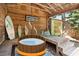 Covered patio features hot tub, surfboard storage, and outdoor seating at 420 E Erie Ave, Folly Beach, SC 29439