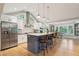 Modern kitchen with blue island and stainless steel appliances at 420 E Erie Ave, Folly Beach, SC 29439