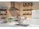 Stylish kitchen featuring white cabinets and open shelving at 420 E Erie Ave, Folly Beach, SC 29439