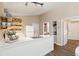 Modern white kitchen with island and stainless steel appliances at 420 E Erie Ave, Folly Beach, SC 29439