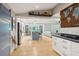 Open kitchen to hallway with modern finishes at 420 E Erie Ave, Folly Beach, SC 29439