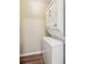 Stackable washer and dryer in a compact laundry room at 420 E Erie Ave, Folly Beach, SC 29439