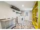 Laundry room with washer, dryer, stainless steel counter and built-in shelving at 420 E Erie Ave, Folly Beach, SC 29439
