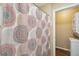 Small laundry area with stacked washer and dryer at 420 E Erie Ave, Folly Beach, SC 29439