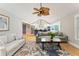 Vaulted ceiling living room with hardwood floors and comfy seating at 420 E Erie Ave, Folly Beach, SC 29439