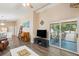 Open living area with a comfortable leather couch and large TV at 420 E Erie Ave, Folly Beach, SC 29439