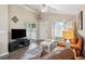 Bright living room with leather furniture and hardwood floors at 420 E Erie Ave, Folly Beach, SC 29439