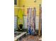 Outdoor shower with surfboard and patterned shower curtains at 420 E Erie Ave, Folly Beach, SC 29439