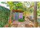 Private outdoor shower with wooden walls and pink towels at 420 E Erie Ave, Folly Beach, SC 29439