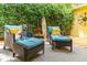 Relaxing patio with wicker chairs and a view of lush greenery at 420 E Erie Ave, Folly Beach, SC 29439
