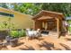 Relaxing patio with seating area and surfboard storage at 420 E Erie Ave, Folly Beach, SC 29439