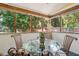 Bright screened porch, perfect for relaxing and dining at 420 E Erie Ave, Folly Beach, SC 29439