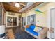 Relaxing screened porch with wicker sofa and access to the backyard at 420 E Erie Ave, Folly Beach, SC 29439