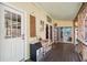 Covered porch with exterior access and convenient ice maker at 420 E Erie Ave, Folly Beach, SC 29439