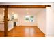 Bright dining room with hardwood floors and kitchen view at 488 Society Rd, McClellanville, SC 29458