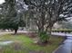 Landscaped yard with mature trees and green space at 488 Society Rd, McClellanville, SC 29458