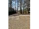 Large backyard featuring a wood fence and mature trees provides a private outdoor retreat at 611 Resinwood Rd, Moncks Corner, SC 29461