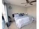 Spacious bedroom with carpeted floor, ceiling fan, and large window at 611 Resinwood Rd, Moncks Corner, SC 29461