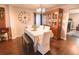 Dining room with hardwood floors, a table, and white chairs at 611 Resinwood Rd, Moncks Corner, SC 29461