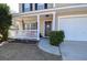 Front porch with white railing, and dark brown door at 611 Resinwood Rd, Moncks Corner, SC 29461