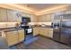 Modern kitchen with stainless steel appliances and light wood cabinets at 611 Resinwood Rd, Moncks Corner, SC 29461