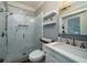 Bathroom with walk-in shower, toilet, and white vanity with marble top at 6124 Rudder Ln, Awendaw, SC 29429