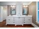 Double vanity bathroom with white cabinets and marble countertops at 6124 Rudder Ln, Awendaw, SC 29429