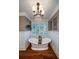 Bathroom featuring a freestanding soaking tub and hardwood floors at 6124 Rudder Ln, Awendaw, SC 29429