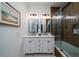 Bathroom with double vanity, frameless shower and wood tile at 6124 Rudder Ln, Awendaw, SC 29429
