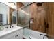 Bathroom with sliding door shower, white vanity and wood tile at 6124 Rudder Ln, Awendaw, SC 29429