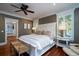 Spacious primary bedroom with hardwood floors, large windows, and a cozy sitting area at 6124 Rudder Ln, Awendaw, SC 29429