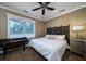 Bedroom with king size bed, wooden headboard and ceiling fan at 6124 Rudder Ln, Awendaw, SC 29429
