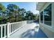 Spacious deck with white railings offers scenic views at 6124 Rudder Ln, Awendaw, SC 29429