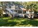 Backyard view of two-story home with inviting pool at 6124 Rudder Ln, Awendaw, SC 29429