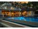 Luxury home with expansive pool and stunning nighttime view at 6124 Rudder Ln, Awendaw, SC 29429