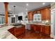 Gourmet kitchen featuring granite countertops, custom cabinetry, and stainless steel appliances at 6124 Rudder Ln, Awendaw, SC 29429