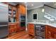 Island kitchen with wine cooler, granite countertops, and ample cabinet space at 6124 Rudder Ln, Awendaw, SC 29429