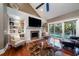 Bright and airy living room with a fireplace and built-in shelving at 6124 Rudder Ln, Awendaw, SC 29429