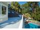 Elevated deck overlooks pool and lush landscape at 6124 Rudder Ln, Awendaw, SC 29429