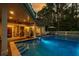 Tranquil pool scene at dusk, showcasing backyard oasis at 6124 Rudder Ln, Awendaw, SC 29429