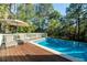 Relaxing pool area with deck and lounge chairs at 6124 Rudder Ln, Awendaw, SC 29429