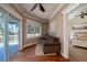 Sitting room with hardwood floors, sliding door to deck, and bedroom view at 6124 Rudder Ln, Awendaw, SC 29429