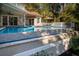 Inviting infinity pool with stone coping at 6124 Rudder Ln, Awendaw, SC 29429