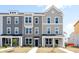 Two-story townhome with gray siding, white trim, and a front porch at 801 Recess Pointe Dr # 55, Moncks Corner, SC 29461