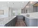 Modern kitchen with gray cabinets, granite countertops, and stainless steel appliances at 801 Recess Pointe Dr # 55, Moncks Corner, SC 29461